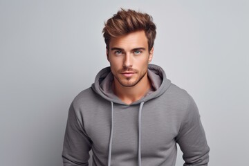 Fototapeta premium photo of a stylish man in a fashionable warm suit. On a light background. Style and fashion concept