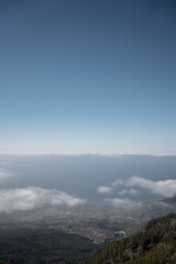 high mountain and green forest over clouds, cloudscape, Tenerife, Canary island