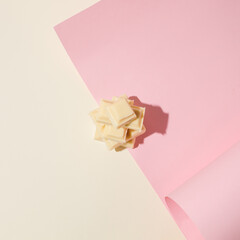 White chocolate on light pink and beige background.