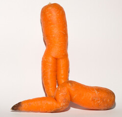 Two crooked carrots are mutants. Association of erotic intimacy.