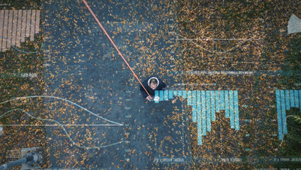 Man stands in autumn forest holding futuristic mobile device and connects to the Internet. Visualization of information flows into the global network Modern 5G communication 