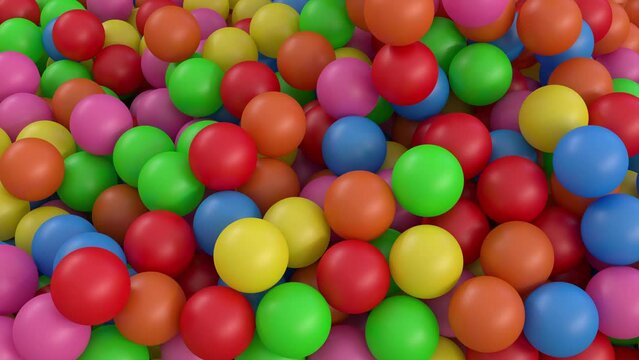 multicolored balls that fall into a ball pool at the daycare or indoor children's fun center