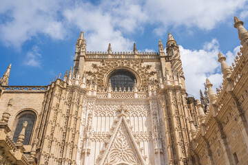 Detail view of Seville cathedral wall and windows with exquisite sculptures