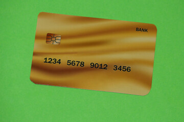 A Gold color card is a very rare card and is a card for millionaires. Picture on green background.