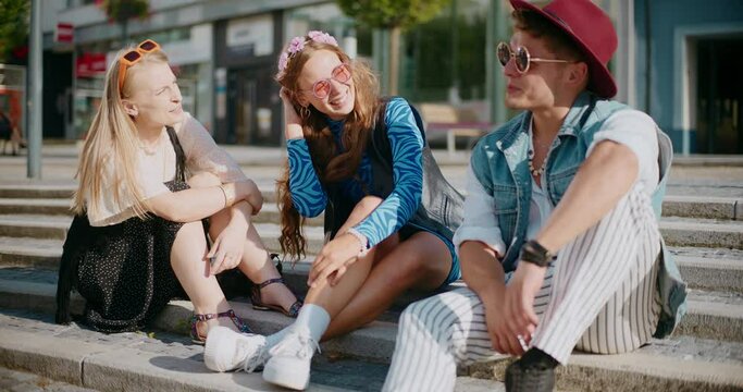 Woman talking with friends sitting on steps