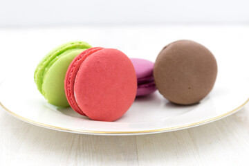 Delicious sweet light macaron dessert. Round multicolored pie.