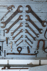 Old shed containing rusty mechanical tools. Vintage old tools with rust