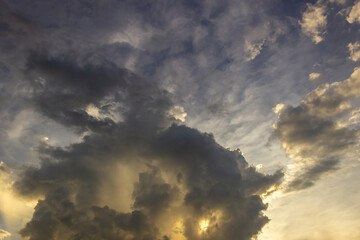 big clouds in the sky and sunrise at sunset