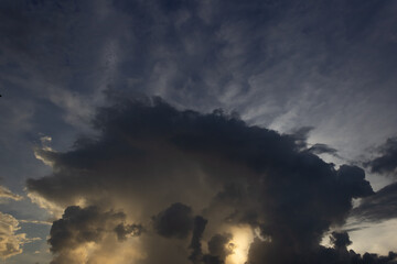 big clouds in the sky and sunrise at sunset