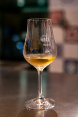 Tasting of cognac spirit aged in old French oak barrels in cellar in distillery in Cognac white wine region, Charente, Segonzac, Grand Champagne, France