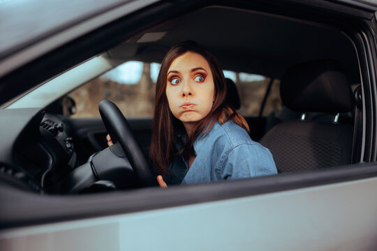 Stressed Woman Driving on the Road Feeling Anxious. Bored alone woman disliking driving her vehicle 
