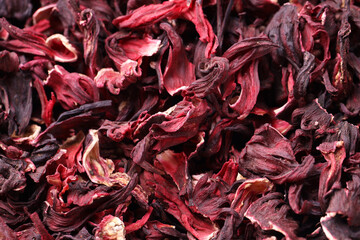 Dry hibiscus tea as background, closeup view