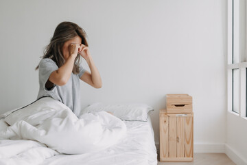 Happy cute asian woman wake up from full nice sleep.