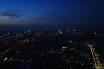 Fototapeta na wymiar Aerial View of Hanoi City from Top of Hanoi, Rooftop Bar at Night in Vietnam - ベトナム ハノイ 夜景