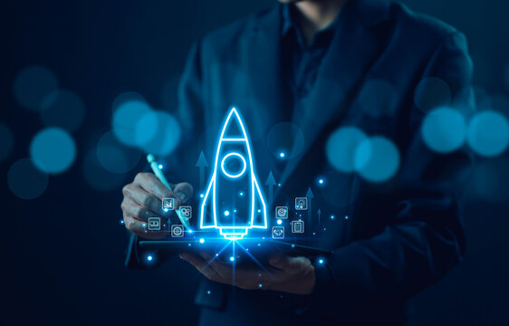 Businessman show rocket start flying up and network line connection. concept of Startup plan development business project digital technology idea of leadership, strategy launch Startup growth