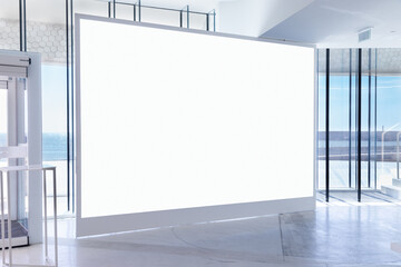 Large horizontal blank advertising poster banner mockup inside a modern building