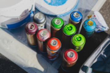 Equipment set for street art, spray cans bottles with aerosol spray paint, creating graffiti and...