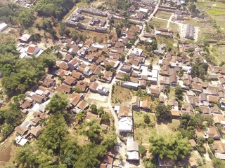 Residential Housing. Aerial drone shot landscape view of densely populated housing in a village at the foot of Mount Pangradinan - Bandung, Indonesia. Dense housing, Aerial Landscape