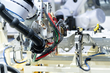 Fototapeta na wymiar robot arm working in car factory