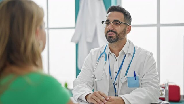 Man And Woman Doctor Shaking Hand To Patient At The Clinic