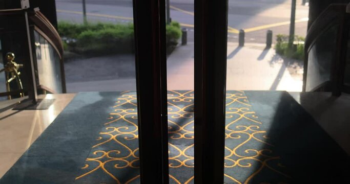 Leaving the hotel. The doors of a luxurious hotel swing open. Automatic doors