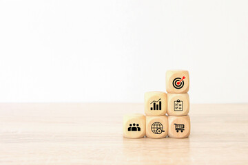 Hand choose cube wooden block stack pyramid with bull eyes target goal win and business strategy...