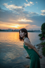 Fototapeta na wymiar woman on the beach at sunset