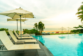 Fototapeta premium chair pool around swimming pool in hotel resort