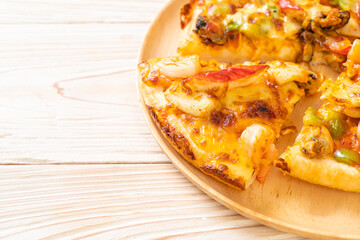 seafood pizza on wood tray