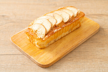 apple loaf crumbled on wood board