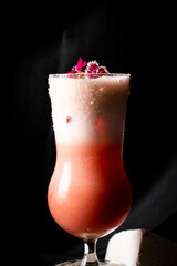 cocktail - infused vodka with strawberry , infused sweet Vermont with chocolate, white egg, syrup, lime juice, topping with magic pop