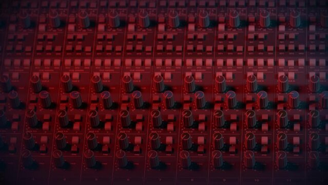 Recording Studio Mixing Desk

The camera pans up the studio console to reveal the audio level meters at the top. The camera stays at this point to allow space for copy or other graphics.