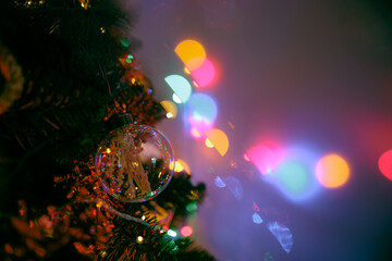 Colorful Detail from a Christmas tree with ornamental Balls and Lights. Beautiful ornaments for...
