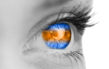 Digital png photo of blue and orange eye of woman on transparent background