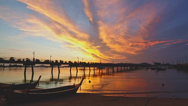 .amazing colorful cloud in beautiful sunrise above the sea at Chalong pier..scenery fishing boats at Chalong pier..Chalong pier very important for travel business it is a center for all boat. .