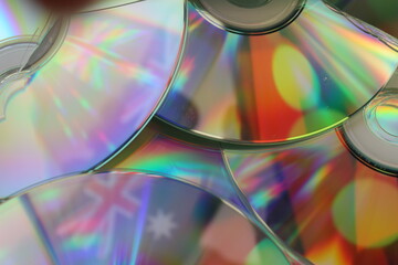 The Australian and Aboriginal flags reflected in a number of broken compact discs representing the...