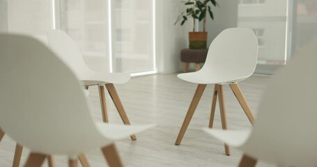 Therapy session, group or circle of empty chair for community meeting, wellness center or company social. Psychology support, consultation room and AA psychiatry rehabilitation via psychotherapy