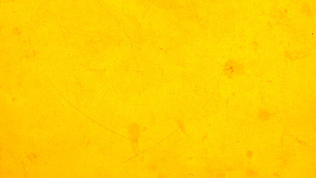 Close-up of yellow textured background. Grunge wall texture. High resolution vintage background.