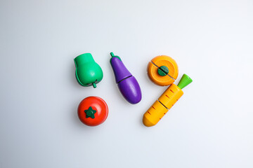 Fresh fruit, vegetables, delicious food, Hamburger and pizza. Colorful educational toys from cute kids.