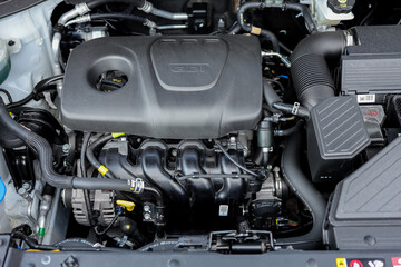 Fototapeta premium Open car hood close up background