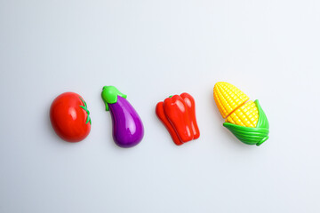 Fresh fruit, vegetables, delicious food, Sushi, 
Hamburger and pizza. Colorful educational toys from cute kids.