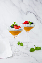 exotic fruit cocktails with berries and chia seed topping and mint side view