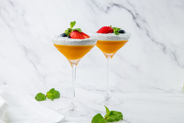 exotic fruit cocktails with berries and chia seed topping and mint side view