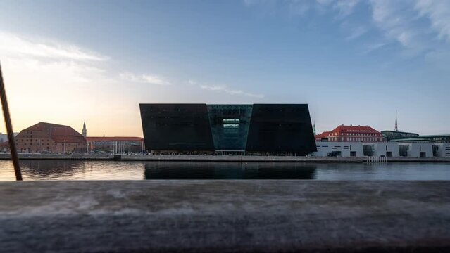 Timelapse clip revealing the black Diamond building (Royal Danish Library) at the waterfront in Copenhagen, Denmark
