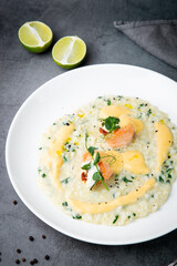 beautifully served porridge with egg and herbs side view