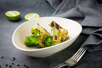 cooked broccoli in mushroom sauce and lime