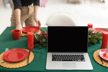 Laptop on the christmas table. Video call with the family