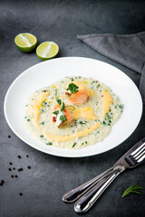 beautifully served porridge with egg and herbs side view