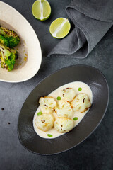 cooked cauliflower in mushroom sauce and lime