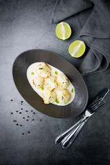 cooked cauliflower in mushroom sauce and lime